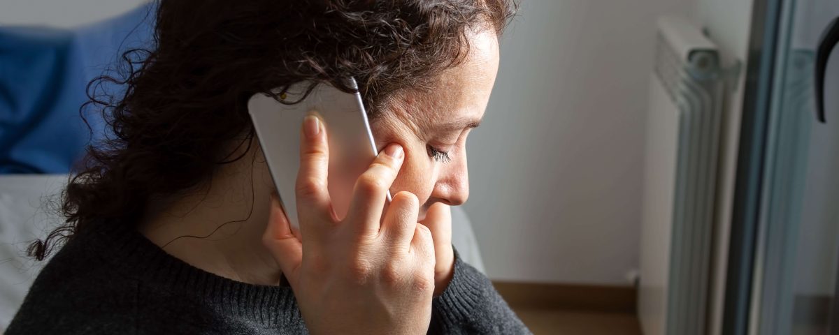 Sadness woman talking by smartphone
