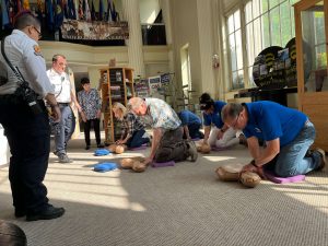 Williamsport/Lycoming County Chamber of Commerce staff learning how to do CPR.