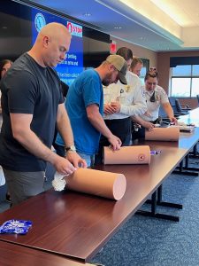 Little League Baseball staff learn how to pack a wound during a Minutes Matter training.
