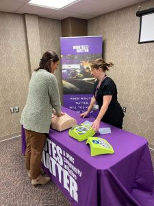 Learning life saving techniques at a UPMC Minutes Matter booth in Mercer County